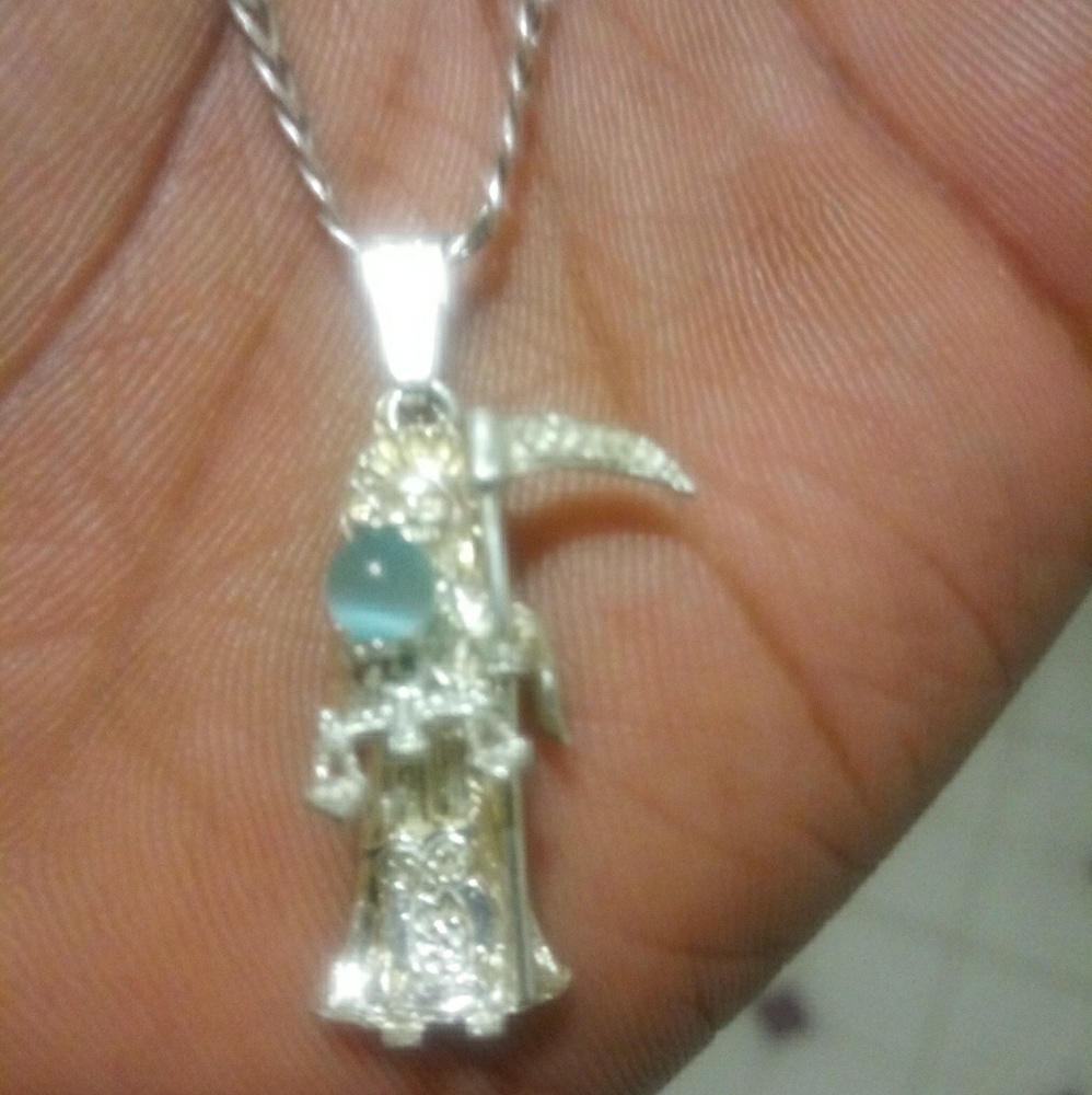 A sterling sliver grim reaper necklace